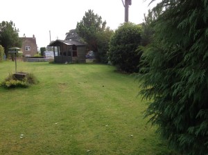 Looking down the length of the garden from front wall to summerhouse