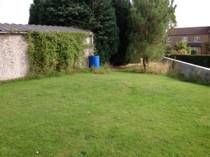 Space between the garage and the summerhouse, aspirations for a raised bed veg plot here